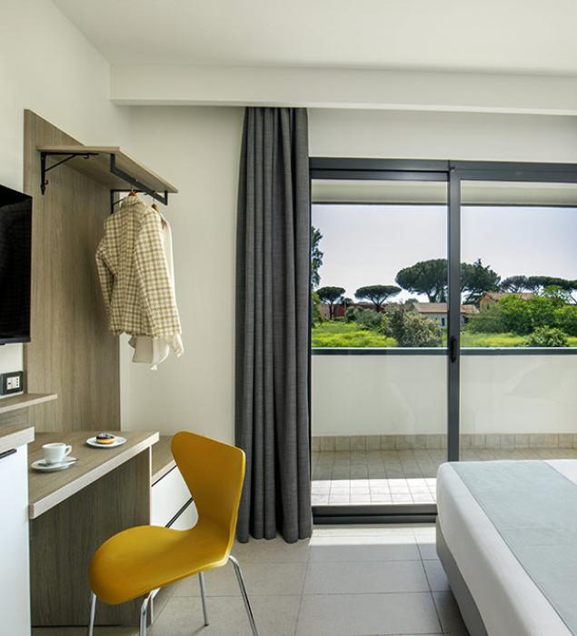 Bright room with green view, modern and cozy.